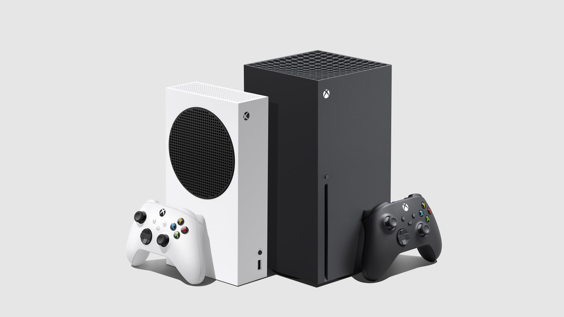 Black and white Xbox Series consoles with matching controllers on a light background.