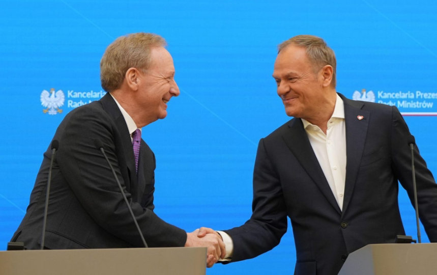 Brad Smith shakes hands with Poland’s Prime Minister, Donald Tusk