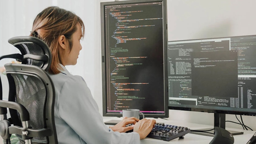 An engineer working on lines of code.