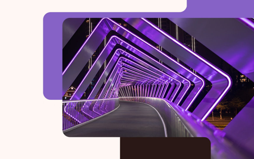 Pedestrian bridge surrounded by purple neon lights.