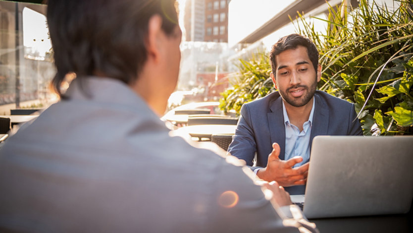 Two businessmen at the meeting.
