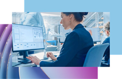 A girl sitting at a desk using a computer
