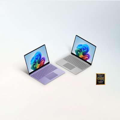 A Violet 13-inch Surface Laptop and a Platinum 13-inch Surface Laptop with the logo for the TechRadar 2026 Australian PC Awards. 