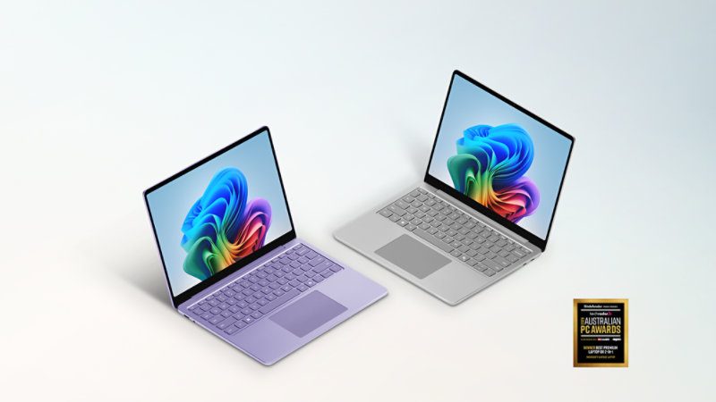 A Violet 13-inch Surface Laptop and a Platinum 13-inch Surface Laptop with the logo for the TechRadar 2026 Australian PC Awards.