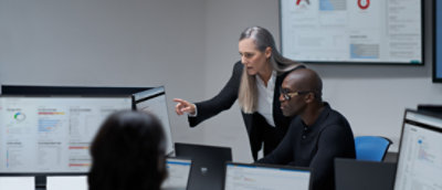 A person pointing at a computer screen