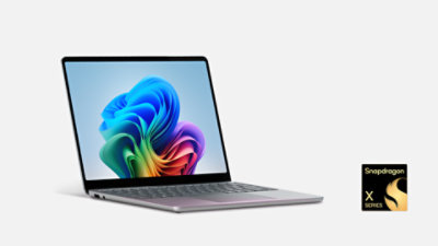 An angled view shows a Surface Laptop, Copilot+ PC, 13-inch in the color Ocean with a Snapdragon badge. 