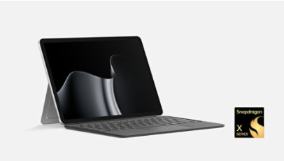 Platinum Surface Pro 12-inch with kickstand and Keyboard, front-left view, Snapdragon X Series.