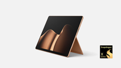 A Surface Pro 13-inch 12ed in the color Dune with a Snapdragon badge. 