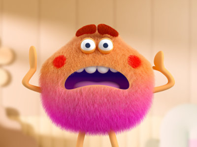 Un adorable monstre orange et pelucheux qui fait une grimace de frustration.