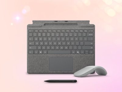 Surface pro keyboard, Slim Pen, Charger block, and Violet Arc Mouse viewed from above