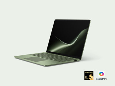 An angled 13.8-inch Surface Laptop in the color Jade.