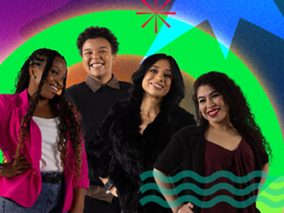 Four women of color smiling together, sharing their experiences in tech at Microsoft.