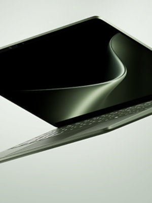 A floating 13.8-inch Surface Laptop in the color Jade.
