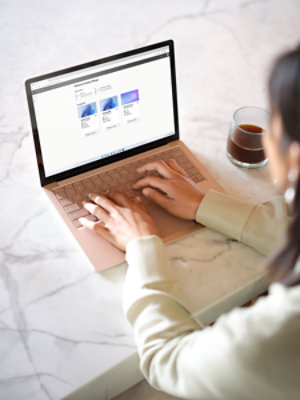 A view of a person using a laptop displaying the Windows 365 portal