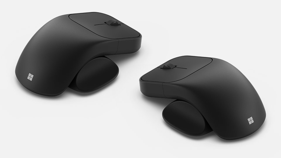 Two views of Microsoft Adaptive Mouse with thumb support accessory on left and right side.