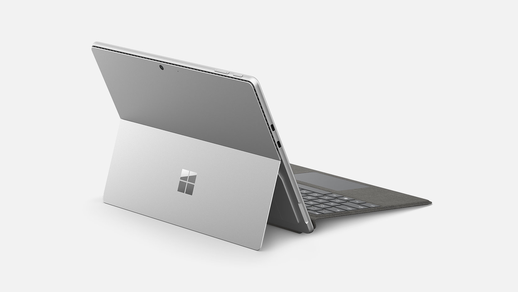 Un dispositivo Surface conectado a un Teclado para Surface Pro para empresas, mostrado el textil Alcantara®. 