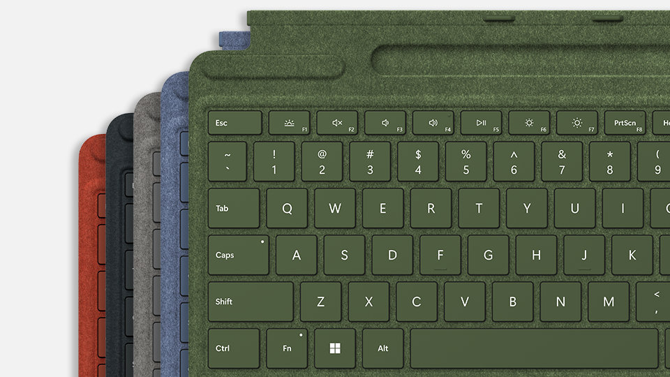 Five Surface Pro Signature Keyboard for Business devices in various colors.