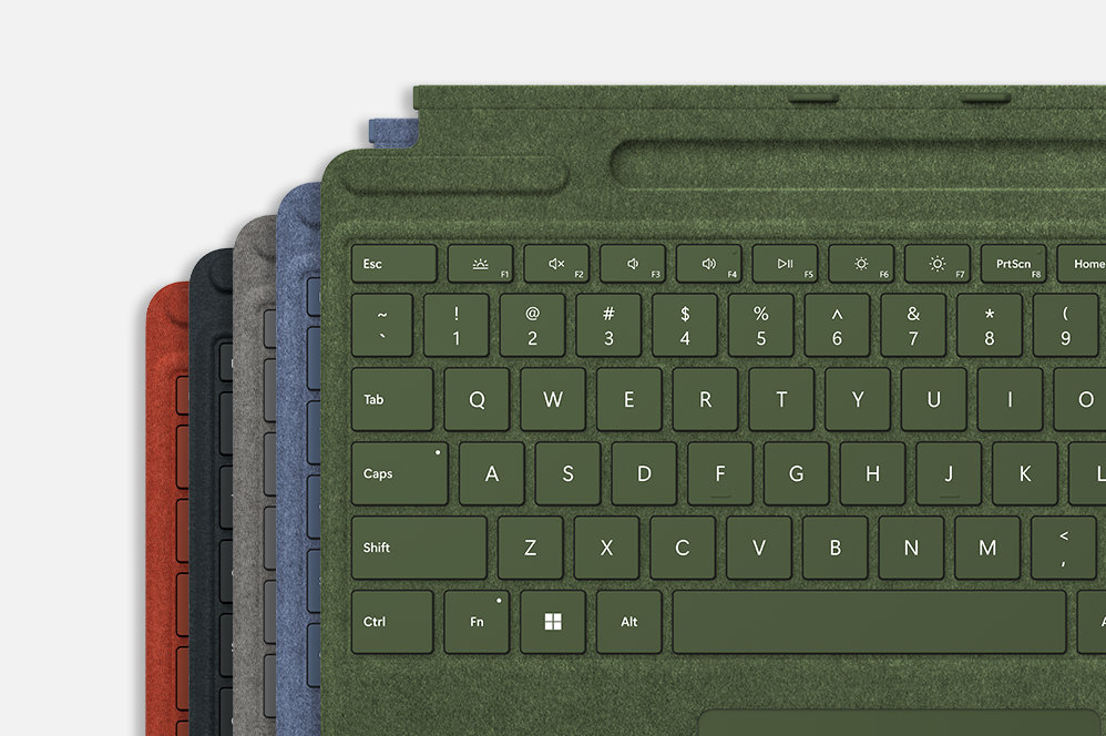 Five Surface Pro Signature Keyboard devices in various colors.