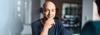 Hands holding a tablet displaying data in charts and graphs in Dynamics 365