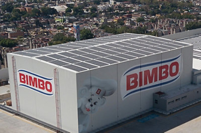 A large white building with red and blue BIMBO text on it.