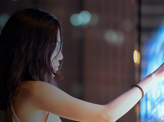 A person using a large touchscreen.