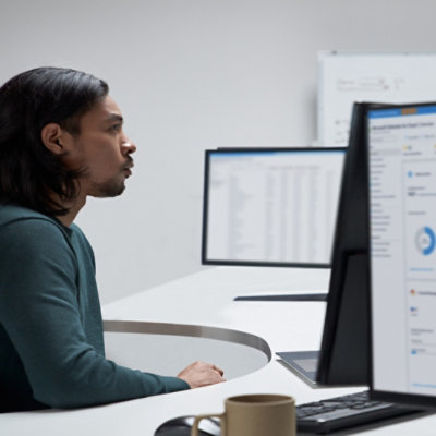 A person looking at the computer screen