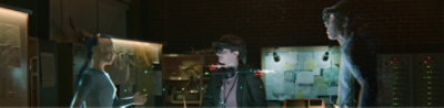 Three people wearing HoloLens 2 having a meeting in augmented reality.