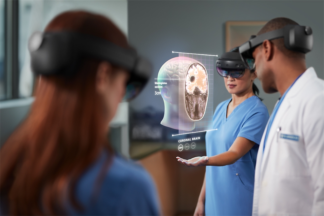 Three healthcare professionals using HoloLens 2 to view a mixed reality diagram of a human head. 