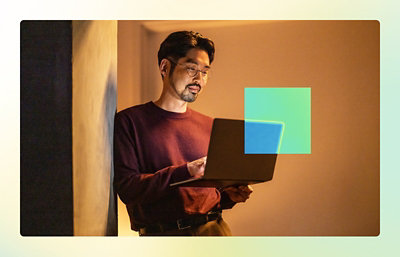 A person holding a laptop.