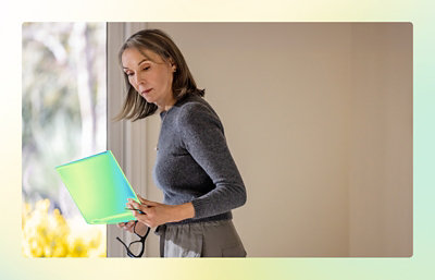 A person holding a laptop.
