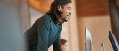 A person standing with his hands on table
