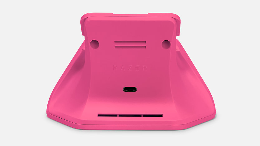 Back view of deep pink Xbox controller charging stand.