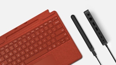 A Surface Pro Signature Keyboard in Poppy Red with a Slim Pen Charger and Thunderbolt Dock 4. 