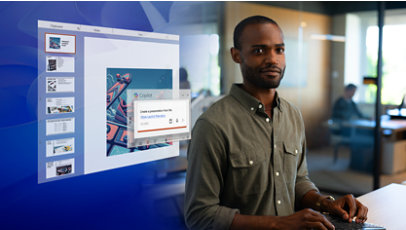 A young man in an office uses Microsoft Copilot to create a Power Point deck.