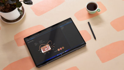 Tablet and coffee cup on table