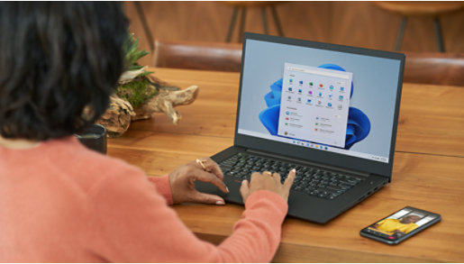 Small child doing an online class with crafting materials nearby.