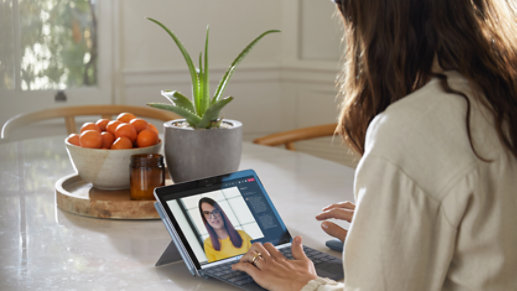 A person getting free product advice from a Microsoft Store associate