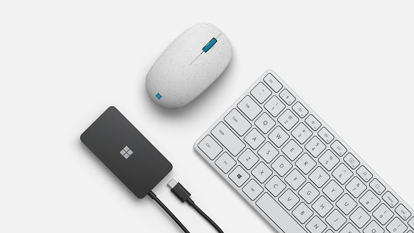 Microsoft Ocean Plastic Mouse, Microsoft USB-C Travel Hub and Microsoft Designer Compact Keyboard in Glacier.