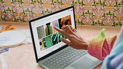 A student creates a colourful mood board in PowerPoint for a fashion design class.