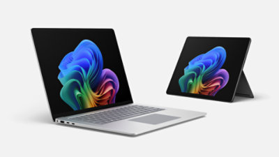 Ein Surface Laptop for Business in Platin und ein Surface Pro for Business in Schwarz. 