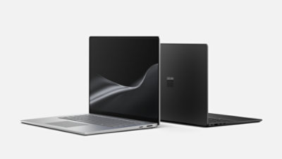 A 15-inch Surface Laptop for Business in the color Platinum and a 13.8-inch Surface Laptop for Business in the color Black with Intel® processors, displayed back-to-back.