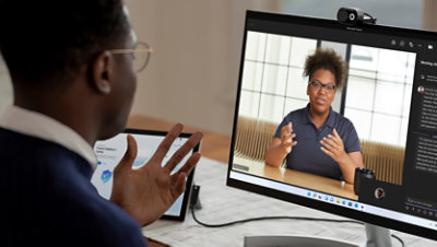 Man sitting at a desk having a virtual training session.