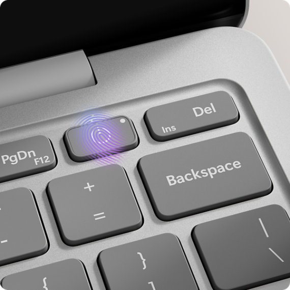 Vista aproximada do botão de alimentação com leitor de impressões digitais no teclado de um Surface Laptop.