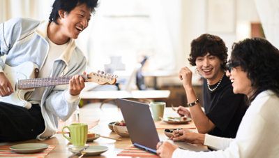 A group of students collaborating on a school project using Office 365 for students.