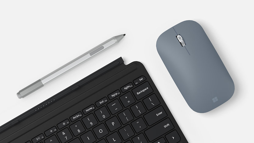 A Surface Go Type Cover, a platinum Surface Pen, and an ice blue Mobile Mouse.