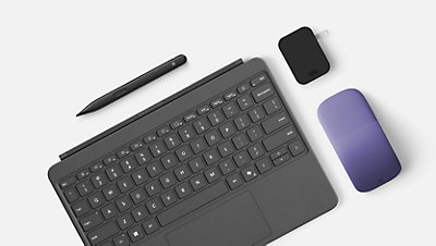 Surface pro keyboard, Slim Pen, Charger block, and Violet Arc Mouse viewed from above. 