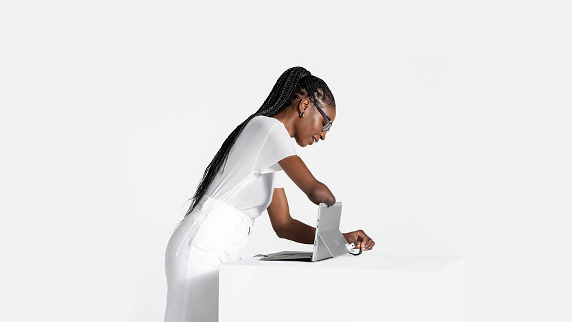 A person using Surface Adaptive Kit on Surface Pro 8.