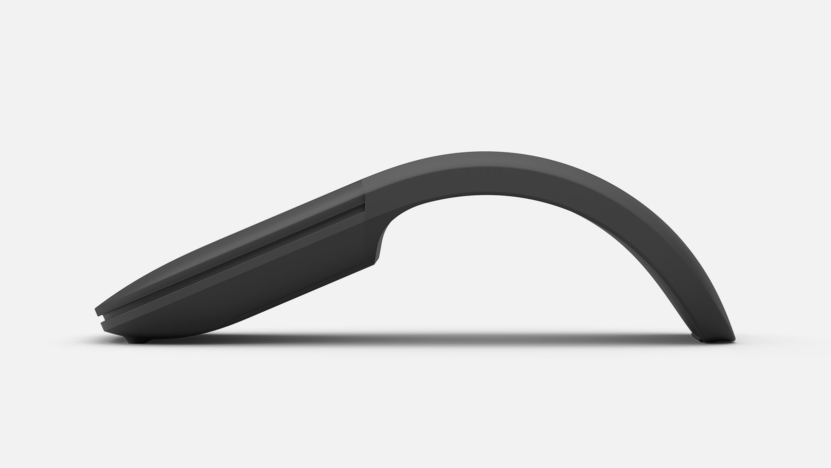 A Surface Arc Mouse sits in a snapped-up position.