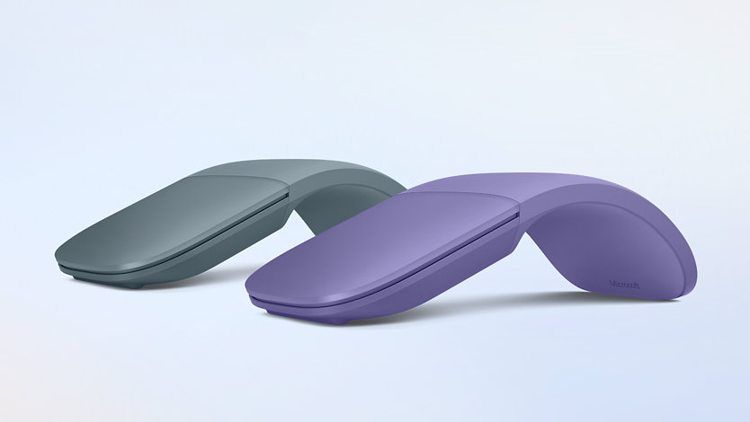 Two Surface Arc Mouse devices in the colours Ocean and Violet.