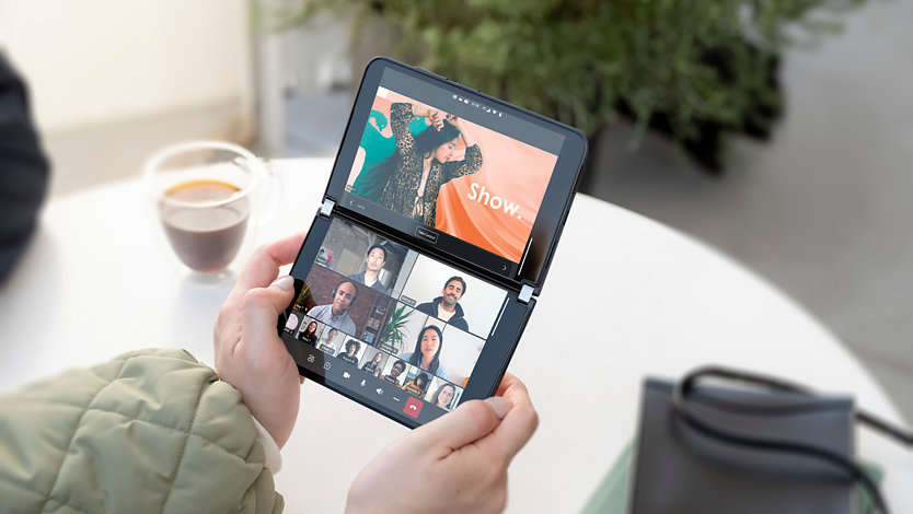 A person holding a Surface Duo 